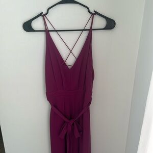 Purple jumpsuit with slits on each leg